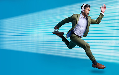 Image showing Business, man in suit and running for appointment, goal driven and headphones for streaming music, motivation or entrepreneur. Male manager, leader or employee with headset, fast or target for growth