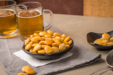 Image showing Tasty lupins and glass of beer