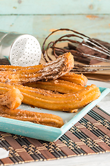 Image showing Traditional churros with hot chocolate 