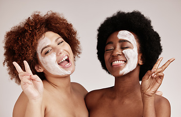 Image showing Face mask, peace sign and friends portrait with happiness for sleepover skincare. Wellness, black women smile and spa aesthetic with lotion and moisturizer for facial and cosmetic treatment in studio