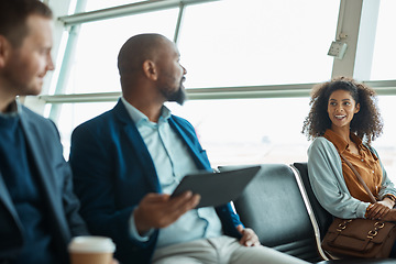 Image showing Airport, travel and talking with business people waiting in a departure lounge for an international flight. Global, transport or journey with a man and woman sitting in line in a terminal for flying