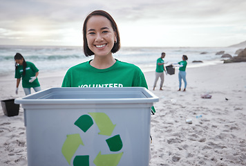 Image showing Recycling bin, portrait of Asian woman and volunteer at beach cleaning for environmental sustainability. Recycle, earth day and happy female ready to stop pollution by ocean for community service.