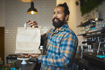 Image showing Cafe, takeaway bag and cashier man or small business owner with sustainable restaurant in customer services. Costa Rica employee, waiter or person giving package, fast food delivery and startup store