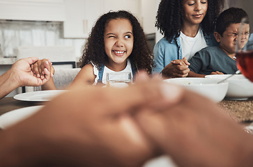 Image showing Happy girl praying with her family for dinner at their home for religion, respect or compassion. Spiritual, gratitude and young child peeping while in a prayer at event, party or supper at her house.