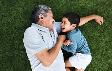 Image showing Playful, laughing and grandfather and child in a garden for happiness, playing and cheerful together. Babysit, happy and senior man with a boy kid for quality time during a fun visit on grass