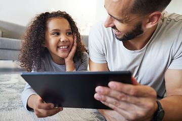 Image showing Kid, father or bonding on tablet in house, home or floor for live streaming, watching movies or education social media. Smile, happy child or man on technology for video call, children website or app