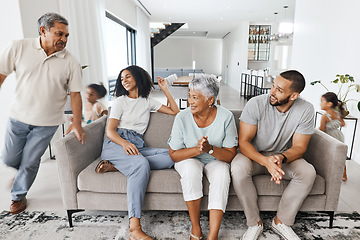 Image showing Grandparents, parents and children in living room playing for bond, quality time and relax together. Big family, love and happy kids in action, running and fun with mom and dad, grandma and grandpa