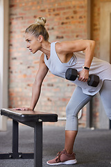 Image showing Bodybuilder goal, dumbbell focus and woman in gym for training, sports and exercise wellness. Thinking, sport strong and athlete with weights for fitness and health workout performance for muscle