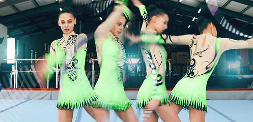 Image showing Dance, gymnastics and woman in gym with ribbon, sport and fast athlete workout. Fitness, female gymnast and flexibility with motion blur or training, exercise or rhythmic performance in sports arena.