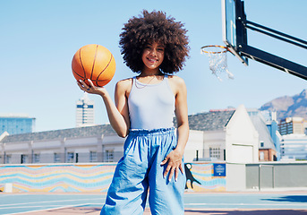 Image showing Basketball court, city and portrait of black woman with smile in trendy, urban style and edgy clothes. Sports, fitness park and girl model outdoors with ball with confidence, happy and cool outfit