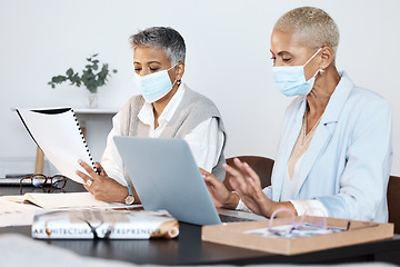 Image showing Business, mask and women with teamwork, laptop and data analysis with discussion, notebook or brainstorming. Corporate, female employees or coworkers with new project, planning and ideas in workplace