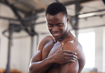 Image showing Black man, exercise and arm pain or sports injury at gym for bodybuilder training, workout or fitness. Healthy person with hand on body muscle for orthopedic or arthritis health problem or fail