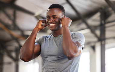 Image showing Music, exercise and man at gym with earphones while training, cardio and fitness on mockup background. Radio, workout and black guy listening to podcast, track or audio at sports center for routine