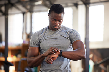 Image showing Fitness, smartwatch and black man in gym for training, workout or exercise results, monitor or progress update, Check, timer and bodybuilder athlete or sports person technology in health and wellness