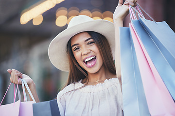 Image showing Woman, shopping bags and portrait smile in the city carrying gifts for discount, deal or purchase. Happy female shopper or excited winner in joyful happiness for luxury, fashion or sale in urban town