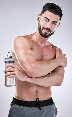 Image showing Fitness, portrait or man with a water bottle in hand to start exercise, body training or gym workout. Sports athlete, model or healthy bodybuilder with motivation ready for exercising in studio