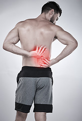 Image showing Fitness, hands or sports man with back pain after exercise, body training injury or gym workout with injured muscle. Red glow, spine or bodybuilder suffering alone isolated on studio background