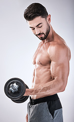 Image showing Fitness, power or strong man with a dumbbell in training, exercise or gym workout for body goals. Sports motivation, focus or healthy bodybuilder weightlifting for biceps growth isolated in studio