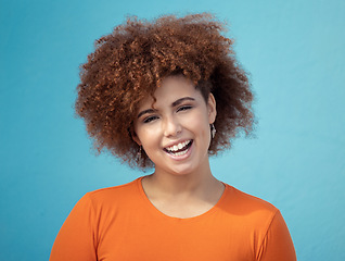 Image showing Black woman, portrait smile and afro for profile, vision hair style against blue studio background. Happy African American female smiling with teeth in joyful happiness or positive attitude on mockup