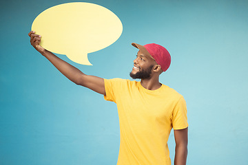 Image showing Speech bubble, advertising and black man on blue background for announcement, news and information. Marketing, opinion mockup and male smile with copy space on poster, billboard and sign for voice