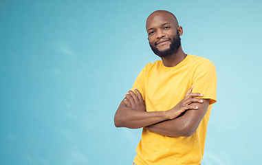 Image showing Black man, portrait smile and arms crossed on mockup for advertising or marketing casual fashion. Happy African American male standing in confidence smiling for profile on a blue studio background