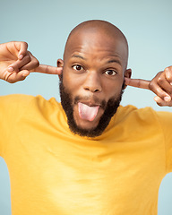 Image showing Comic, playful and portrait of a black man with a funny face isolated on a blue background in studio. Crazy, comedy and silly African person with tongue out for expression, goofy and playing