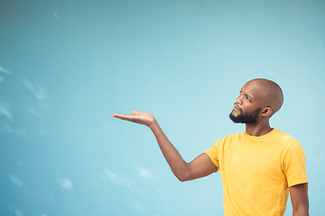 Image showing Advertising, product placement and hand of black man on blue background for announcement, news and information. Marketing, thinking and male show copy space for promotion, branding and idea mockup