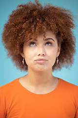 Image showing Comic, thinking and face of woman on blue background with ideas, vision and looking up in studio. Fashion mockup, thoughtful and emoji facial expression of confused girl with attitude and mindset