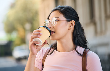 Image showing Mockup, coffee and woman in a city for travel, holiday and vacation on blurred background. Tea, girl and student traveller relax downtown for fun, break and exploring urban street, calm and content