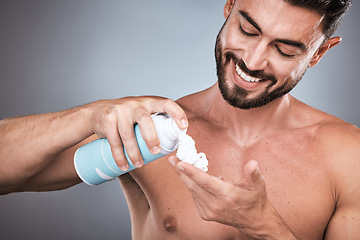 Image showing Hands, shaving cream and man with product in studio isolated on a gray background for hair removal. Skincare, face and happy male model with facial foam to shave for epilation, health and hygiene.