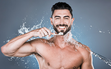 Image showing Water splash, brushing teeth and portrait of man with toothbrush, dental wellness and healthy mouth care. Happy male model, oral cleaning and fresh breath for smile, happiness and shower cosmetics