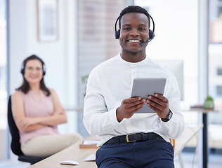 Image showing Portrait, tablet and call center with a black man consultant working in an office for support. Contact us, customer service and consulting with a male telemarketing employee at work using a headset