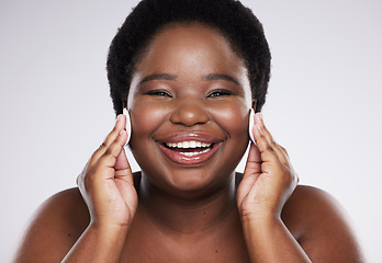 Image showing Black woman with cotton pad isolated on a white background for face or facial cleaning product promotion. Happy portrait of model or person with beauty glow, cosmetics wipe and makeup in studio