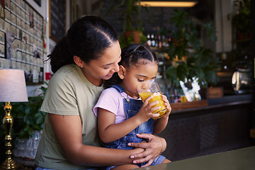 Image showing Coffee shop, black family and hug with a mother and daughter enjoying a beverage in a cafe together. Hugging, caffeine and love with a young woman and happy female child bonding in a restaurant