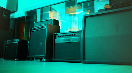 Image showing Vintage, retro and old speakers or music equipment in studio or room with neon blue light for entertainment. Stereo, record and audio tools or loudspeaker with volume and sound as 90s technology