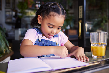 Image showing Little girl, book and color at cafe, creative and drawing with crayons for family day or relax in learning and art. Young kid, growth and writing in education for creativity at coffee shop startup