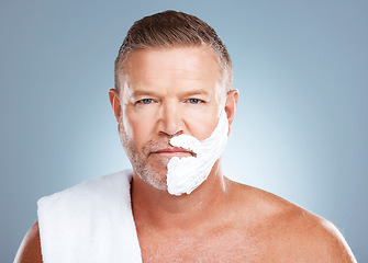 Image showing Portrait, shaving cream and old man in studio for skincare, grooming and beauty on grey background. Face, product and hair removal for mature model relax with luxury, skin and beard foam isolated