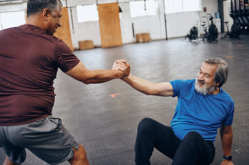 Image showing Teamwork, support and helping hands of friends in gym after workout, exercise and training. Sports, get up and senior men help, collaboration and team work while exercising for health and wellness.