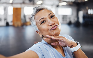 Image showing Selfie, pout and wellness senior woman taking picture in the gym after exercise, workout or training. Elderly, old and portrait of a fit female happy for health and fitness on social media