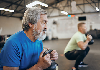 Image showing Fitness, senior and man workout with personal trainer at the gym squat with kettlebell equipment for strength. Elderly, old and training people exercise in a sports club for wellness and health