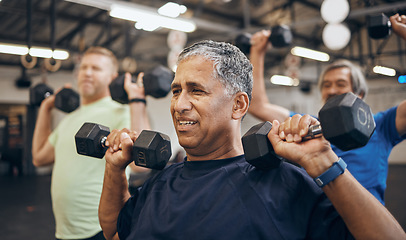 Image showing Training, group and senior men exercise together at the gym lifting weights with dumbbells equipment for strength. Elderly, old and fitness people workout in a sports club for wellness and health