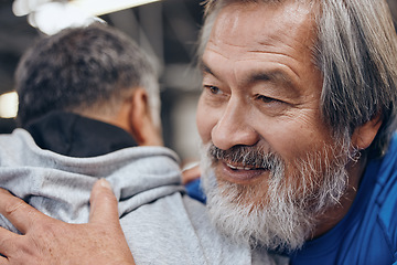 Image showing Friends, fitness and Asian man hug in gym for teamwork, support and motivation for workout. Sports, personal trainer and face of senior guy ready to exercise, bodybuilder training and cardio wellness