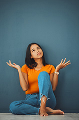 Image showing Woman, thinking and question why in studio for doubt, ideas and decision on mockup background. Confused female model with shrugging, brainstorming and vision mindset of solution, choice and thoughts