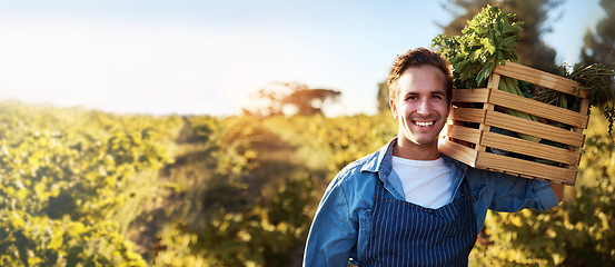 Image showing Agriculture, portrait and mockup with a farm man carrying a basket during the harvest season for sustainability. Agricultural, nature and mock up with a male farmer working outdoor in the countryside