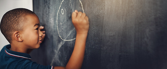 Image showing School, chalk and boy drawing on a board for child development, creativity and art for learning. Academic, creative and young kid student writing on a blackboard in the classroom with mockup space.