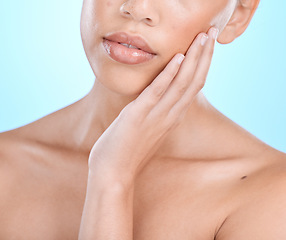 Image showing Closeup, woman and skincare for beauty, dermatology and female on blue studio background. Zoom, girl or lady with cosmetics, natural care or morning routine for grooming, salon treatment or soft skin