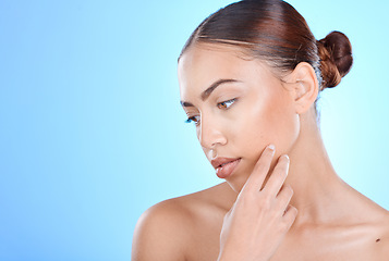 Image showing Skincare, beauty and woman in studio for face, wellness and cosmetics grooming on blue background. Skin, facial and girl model relax in luxury, collagen and dermatology, self care or hygiene isolated