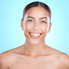 Image showing Skincare, happy and portrait of woman in studio for makeup, wellness or grooming on blue background. Face, beauty and girl skin model relax with luxury, glamour and cosmetic treatment while isolated