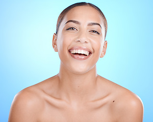 Image showing Black woman, studio portrait and beauty with skincare cosmetics, smile and wellness by blue background. Gen z model girl, happy and healthy aesthetic with dermatology, natural skin glow and cosmetic