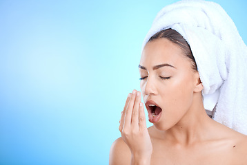 Image showing Shower, grooming and woman smelling breath for oral care isolated on blue background in a studio. Dental, healthcare and girl breathing into hand to check for odor problem on a mockup space backdrop